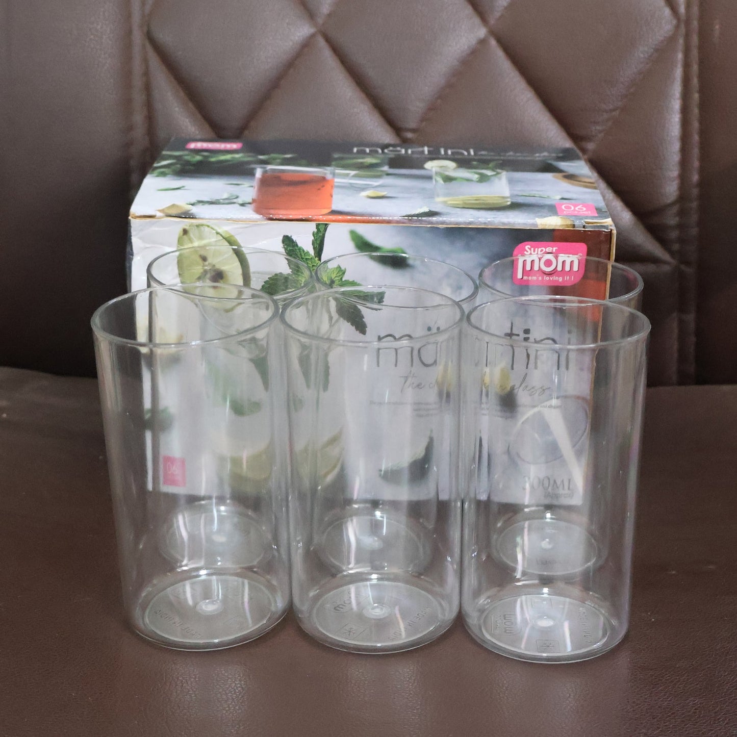Detailed view of Supermom Martini plastic clear glass set showing clarity