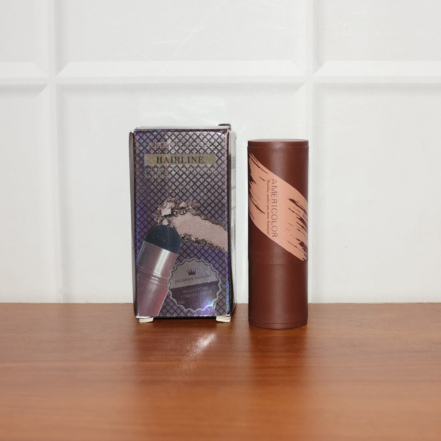 Hairline and eyebrow powder stick showcasing compact design and cushion puff