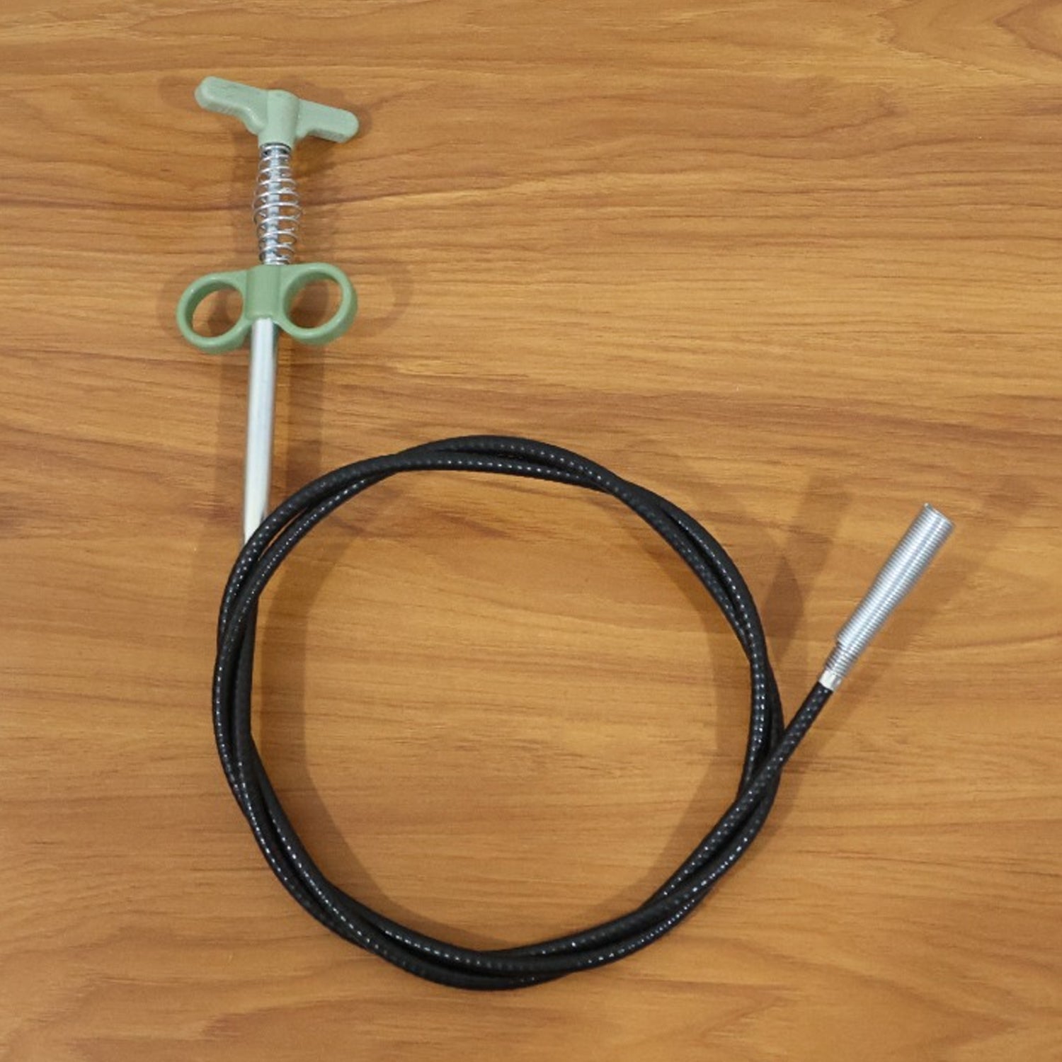 Flexible spring drain cleaning tool with ergonomic hand grip and claw