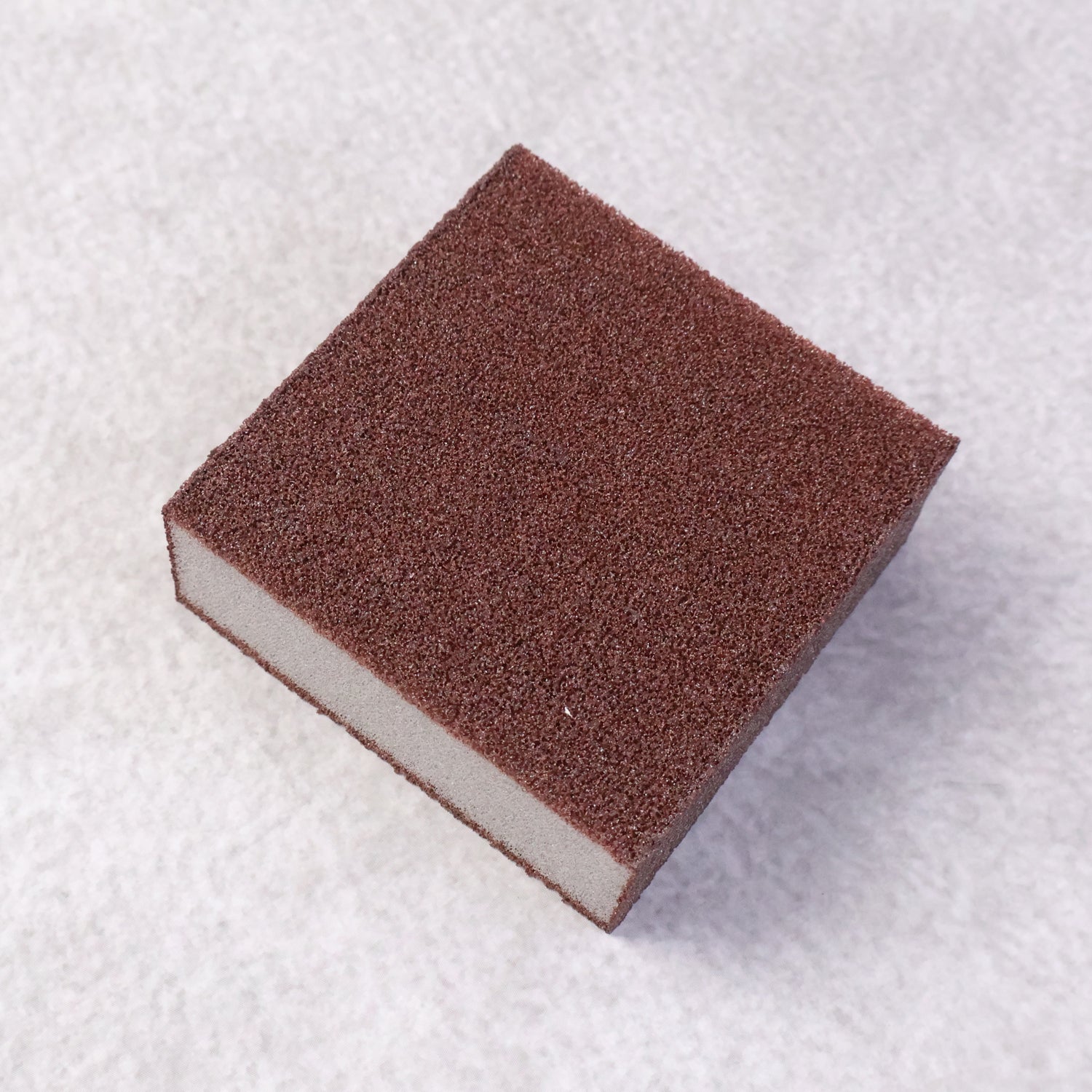 Dish scrubber sponge block removing burnt stains efficiently