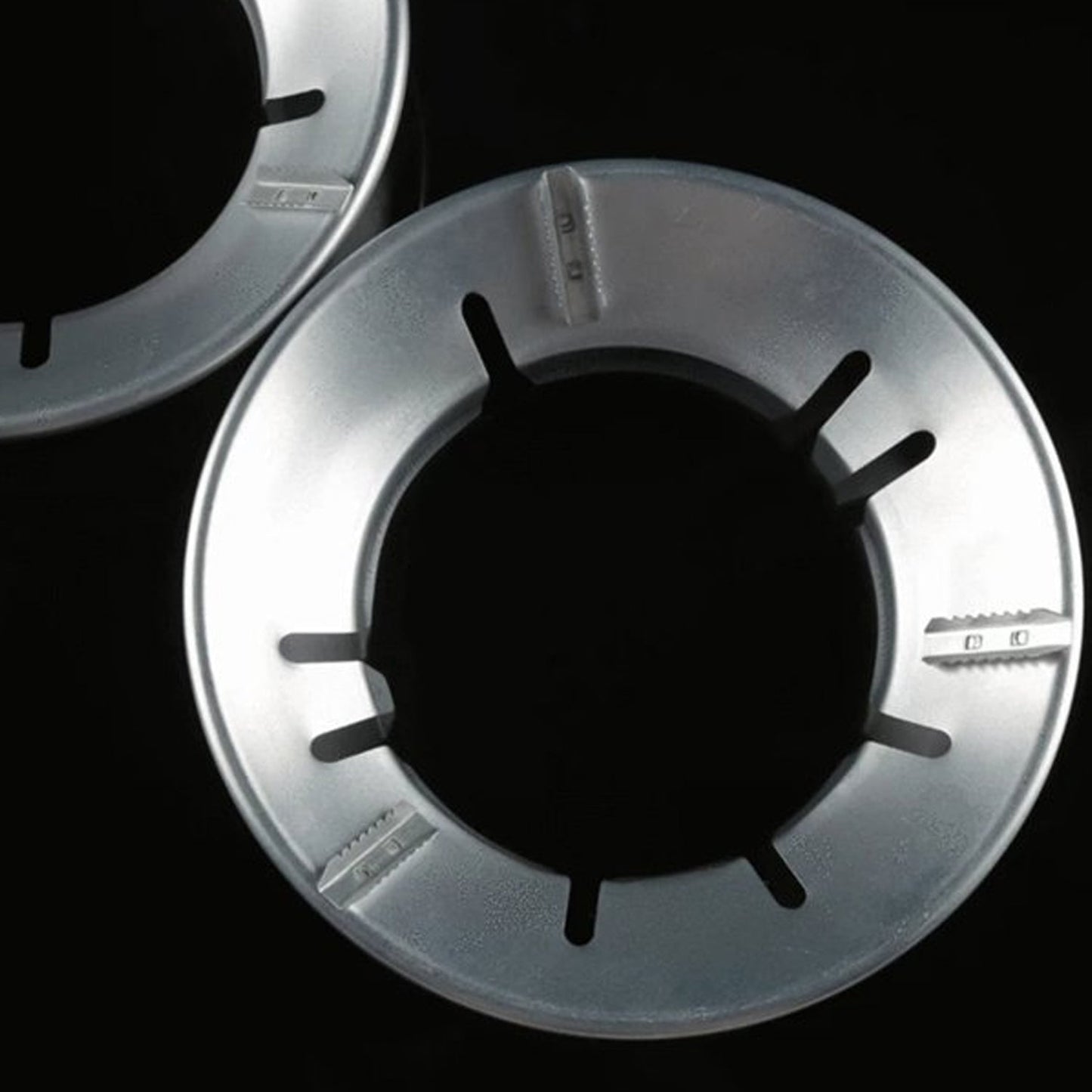 Energy-saving Gas Stove Stand placed on a burner for efficient cooking.