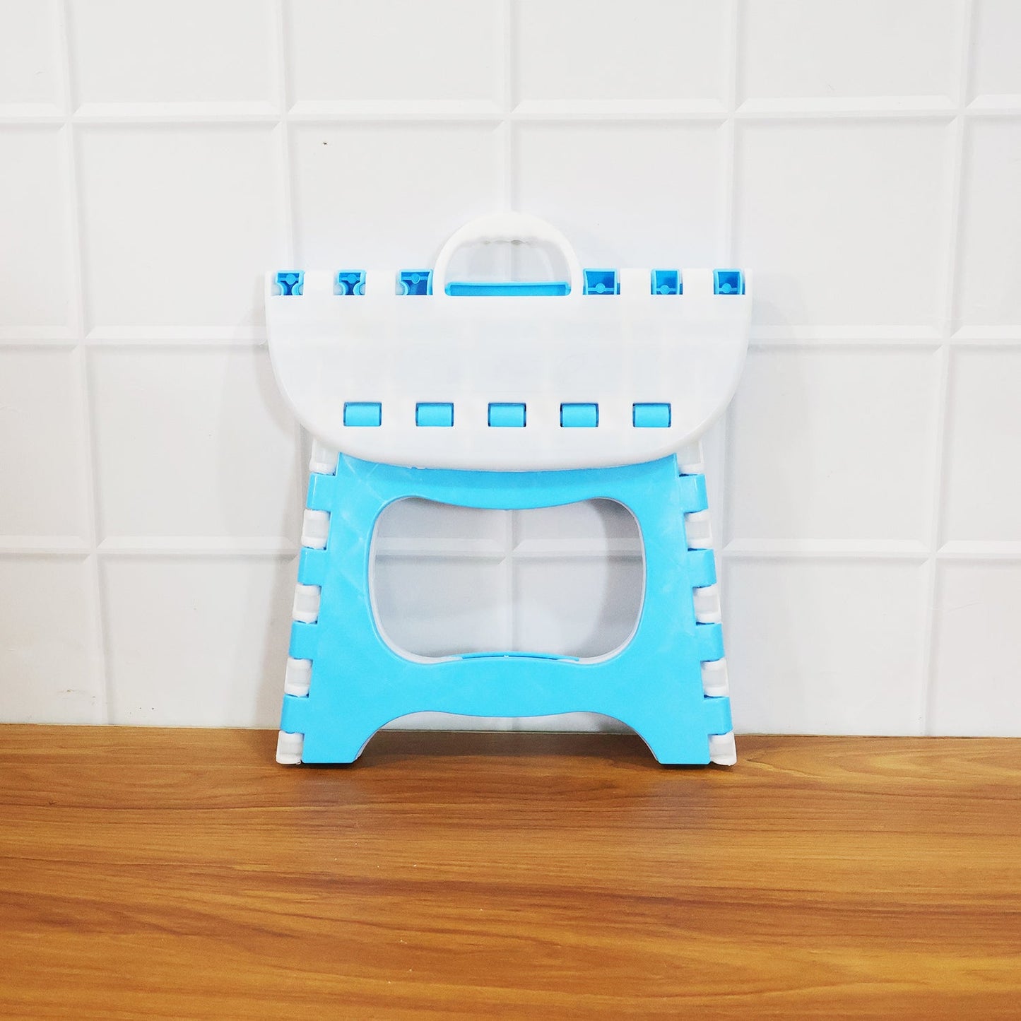 Side view of foldable step stool highlighting slim portable design