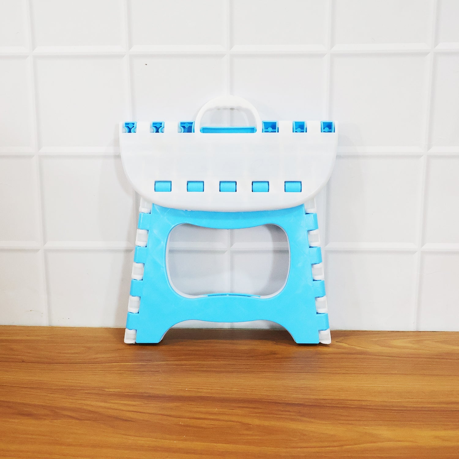 Side view of foldable step stool highlighting slim portable design