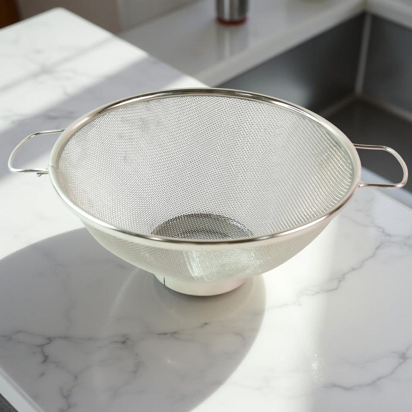 Dual ergonomic welded handles on stainless steel colander for easy grip
