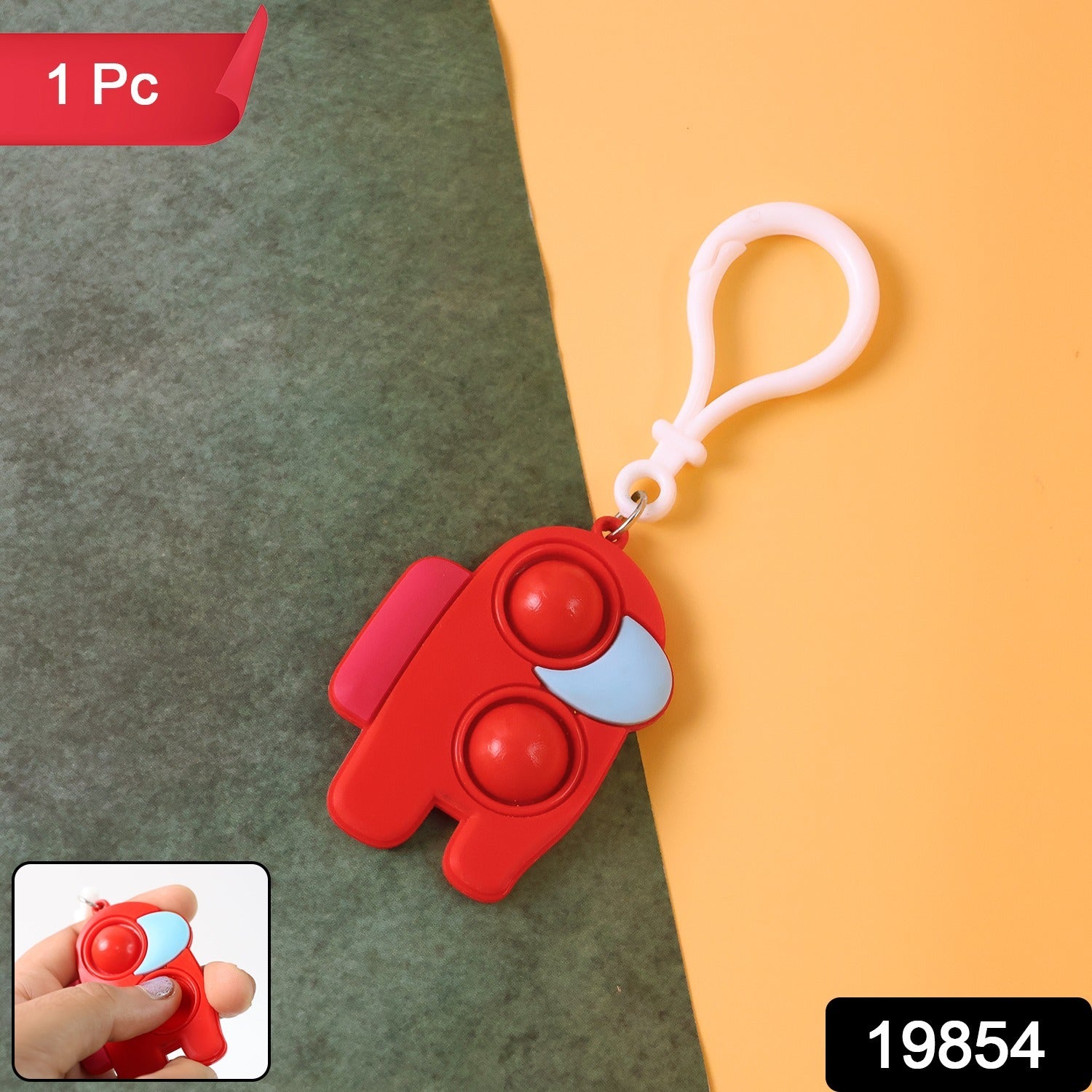 Close-up of a Pop-It Fidget Keychain showing two pushable bubbles and its soft silicone texture.