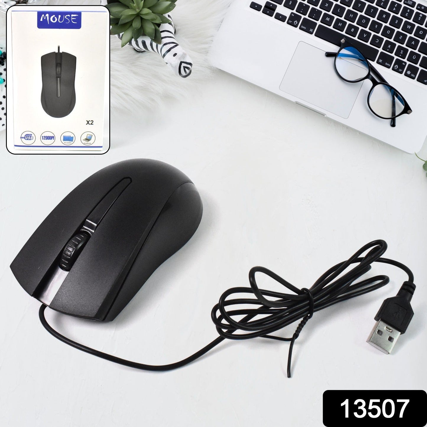 Close-up of the ergonomic Compshop X2 Wired Optical Mouse, highlighting its comfortable grip.