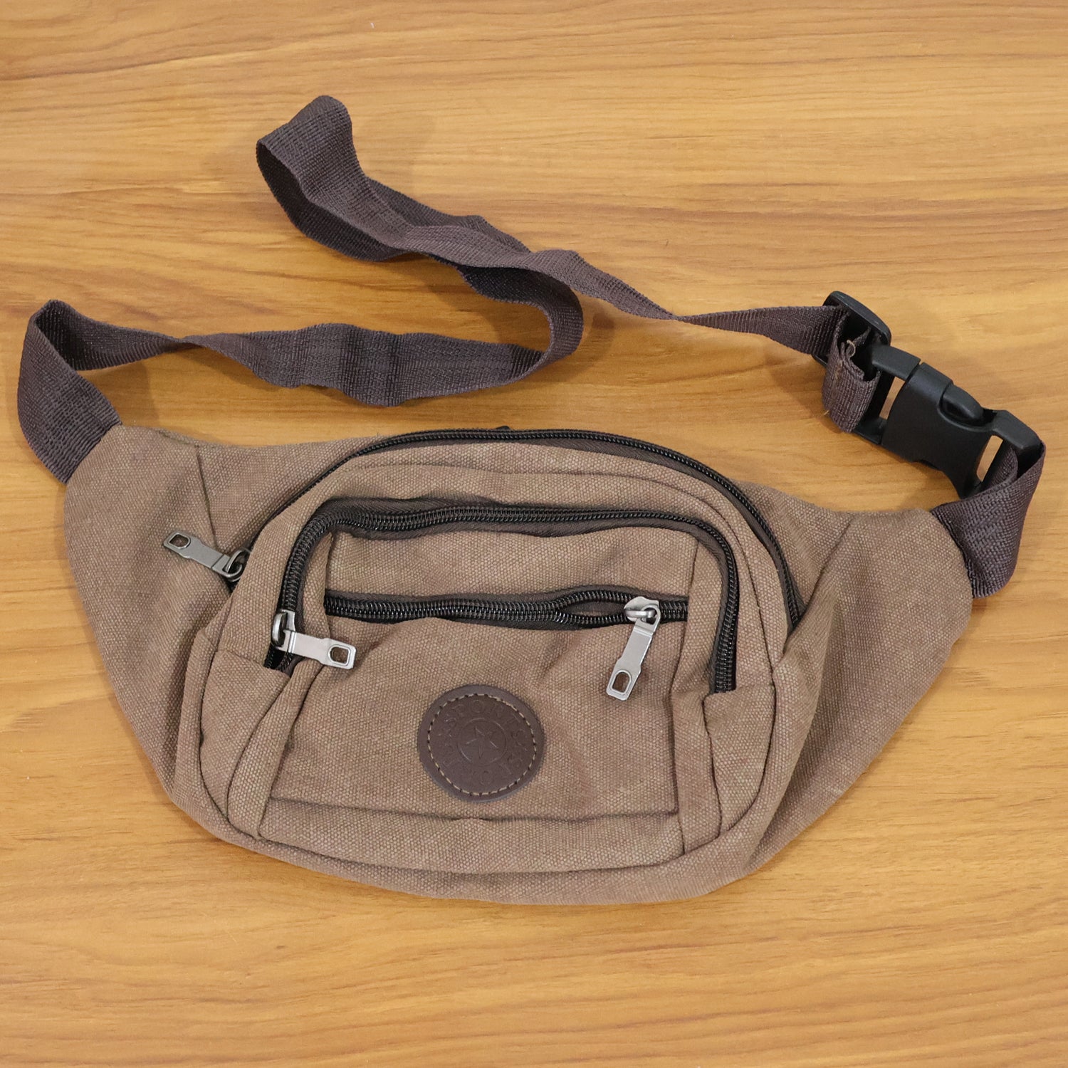 Top view of compact canvas waist bag designed for men and women