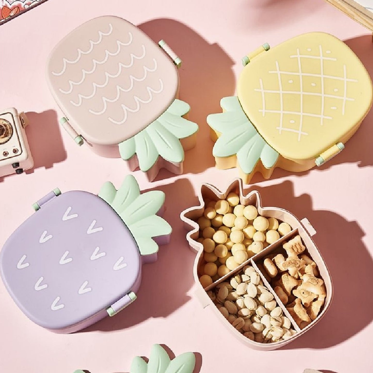 Vibrant pineapple Kids Bento Lunch Box with included fork and spoon.