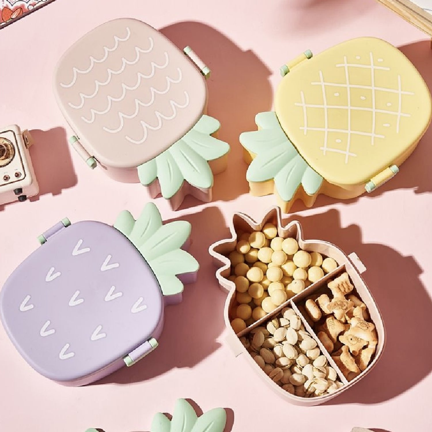 Closed pineapple shaped kids bento lunch box ready for school.