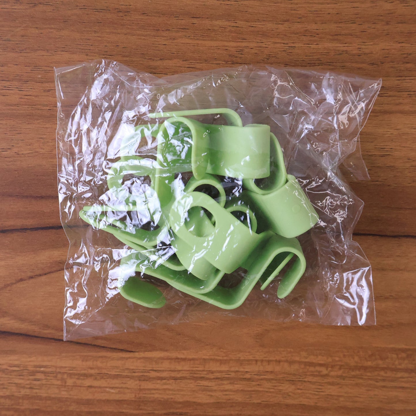 Neatly arranged plastic hanger hooks ready for closet use