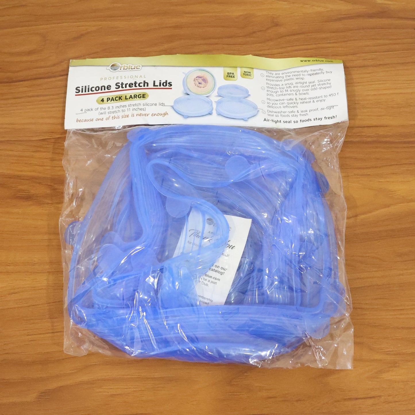 Clear silicone stretch lids protecting leftover food in containers