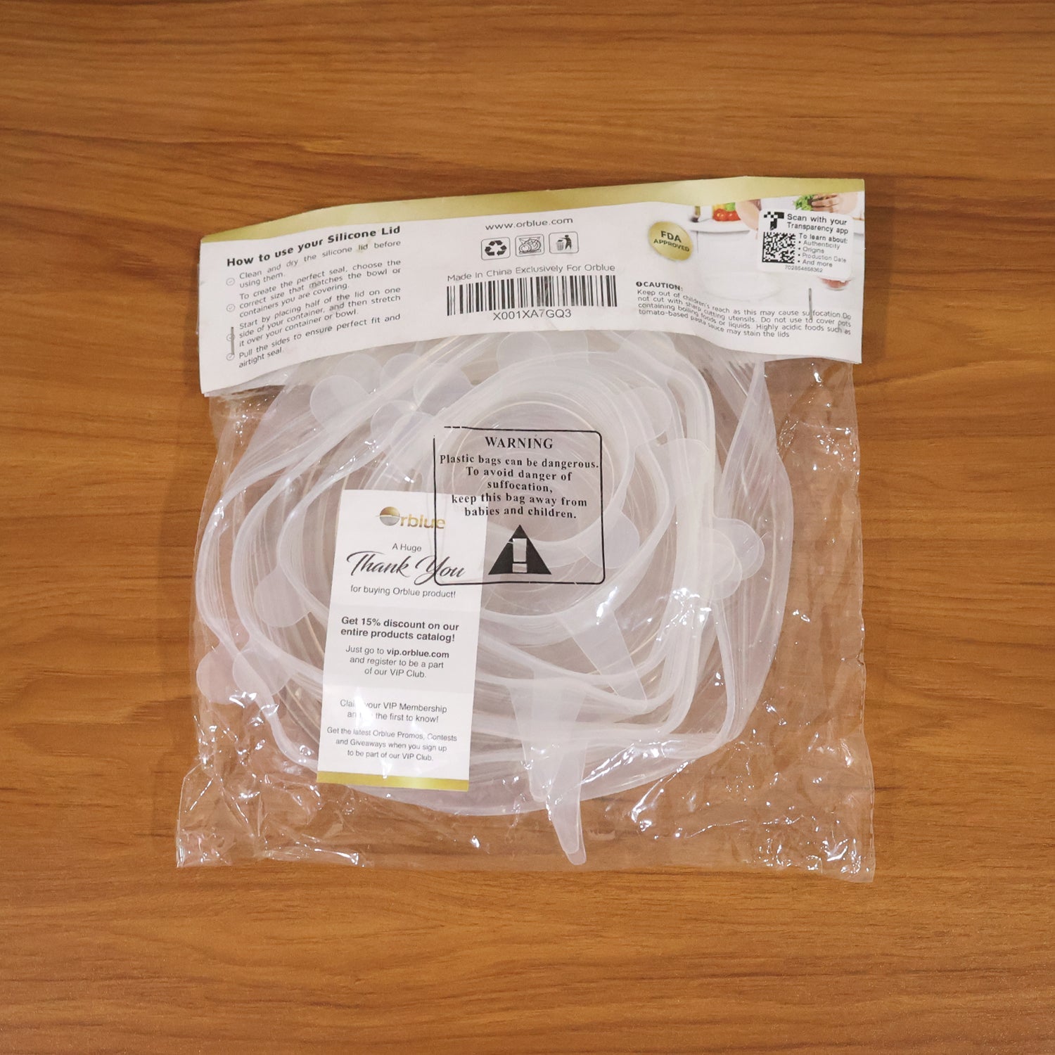 Set of stretchable silicone food covers on assorted containers
