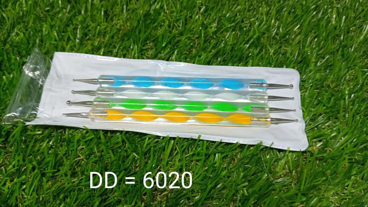 Hand holding nail art pen over palette for design.