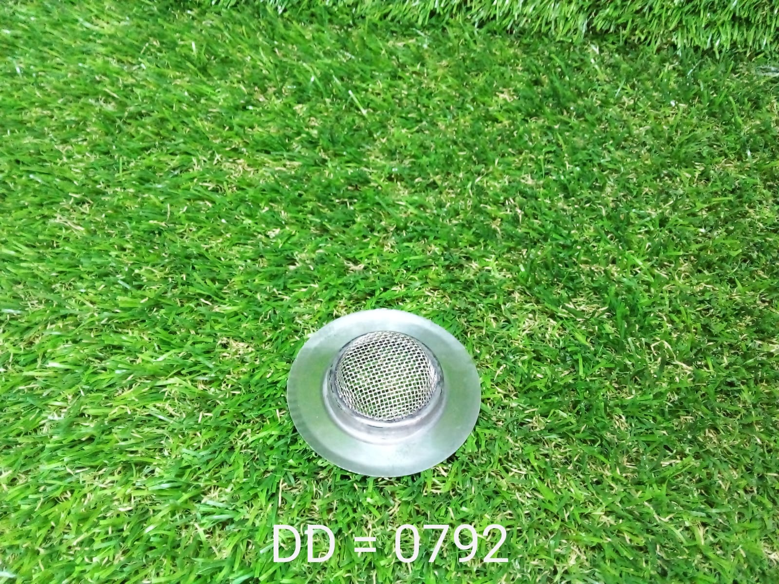 Underside view of the anti-clog sink strainer, highlighting its efficient hole design.