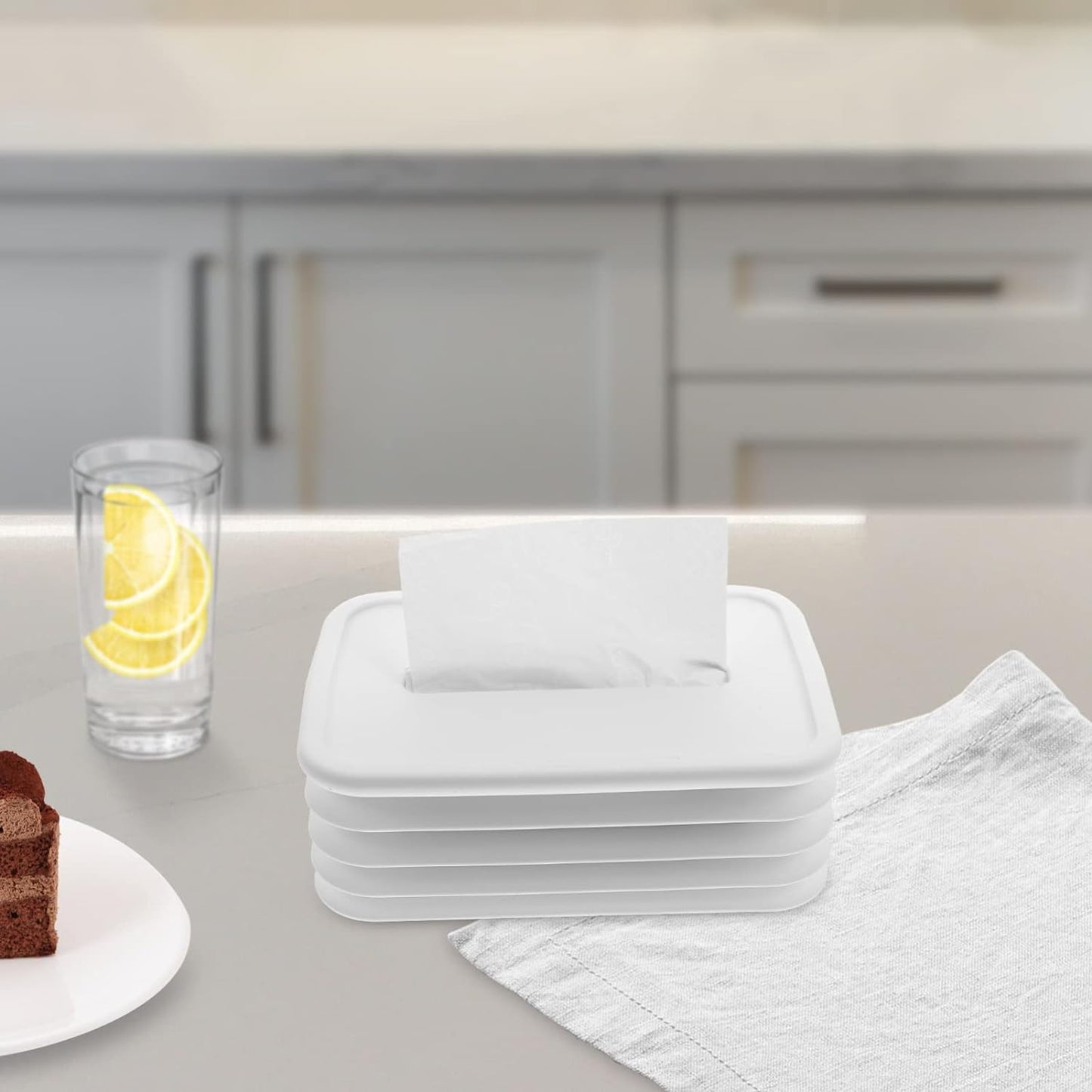 Foldable silicone tissue holder complements a modern living space.