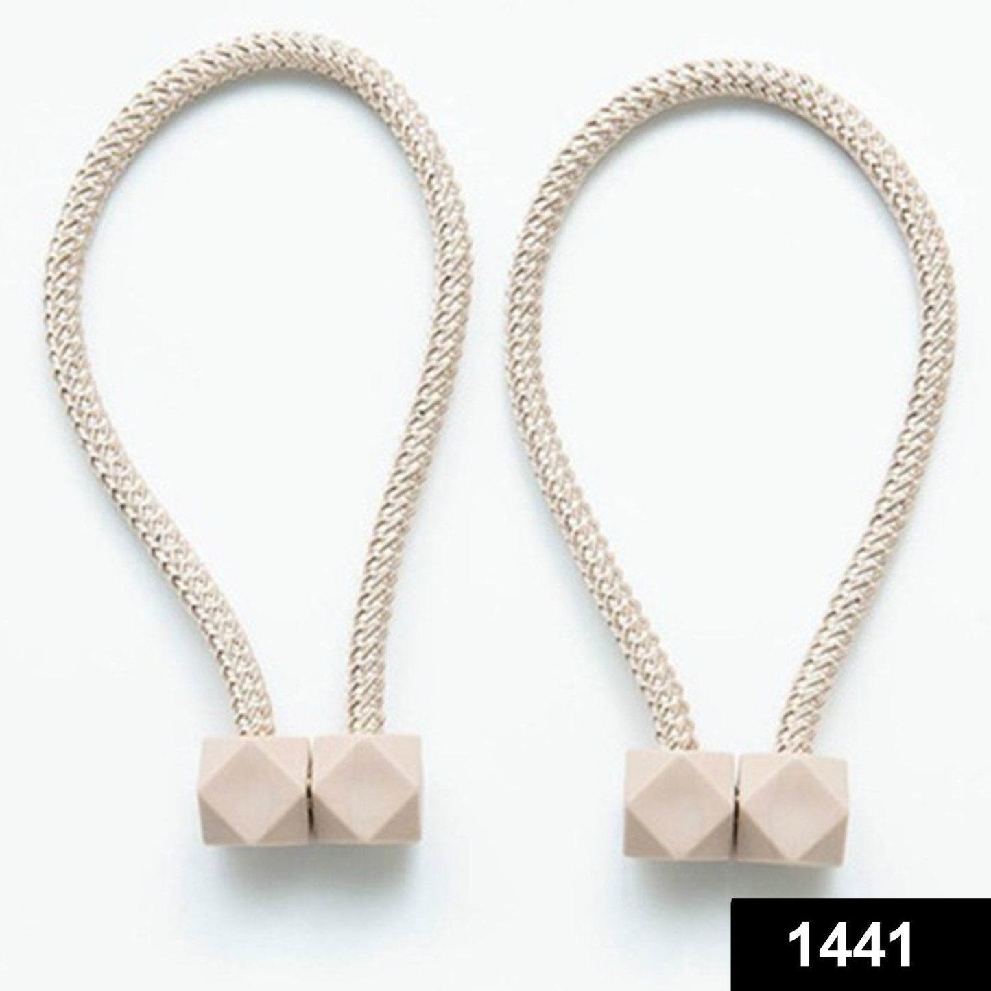 Close-up of a decorative magnetic curtain tieback, showcasing its strong hexagonal magnet.