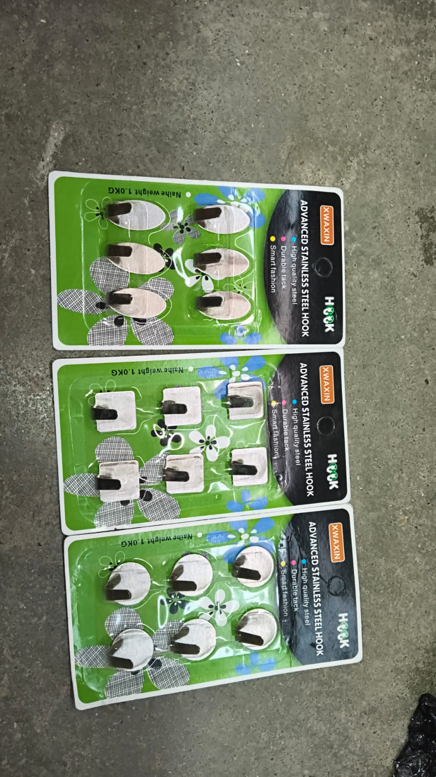 Mounted self adhesive wall hooks holding various items
