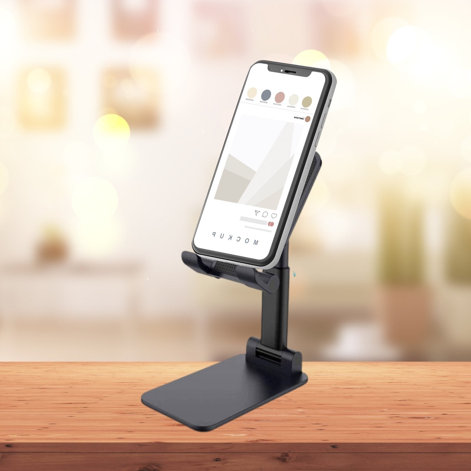 PHOBIA Foldable Mobile Stand in black, ready for use on a desk.