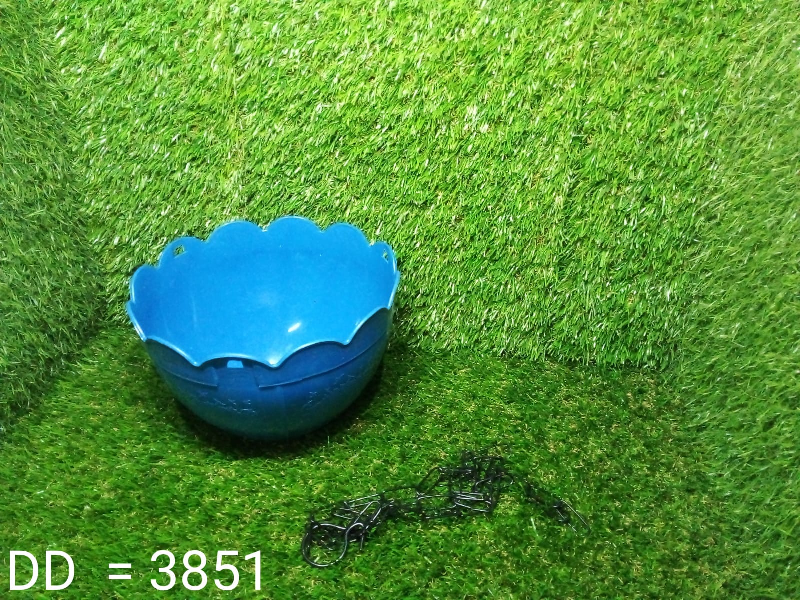 Durable hanging flower pot with drainage hole, suitable for outdoor use.