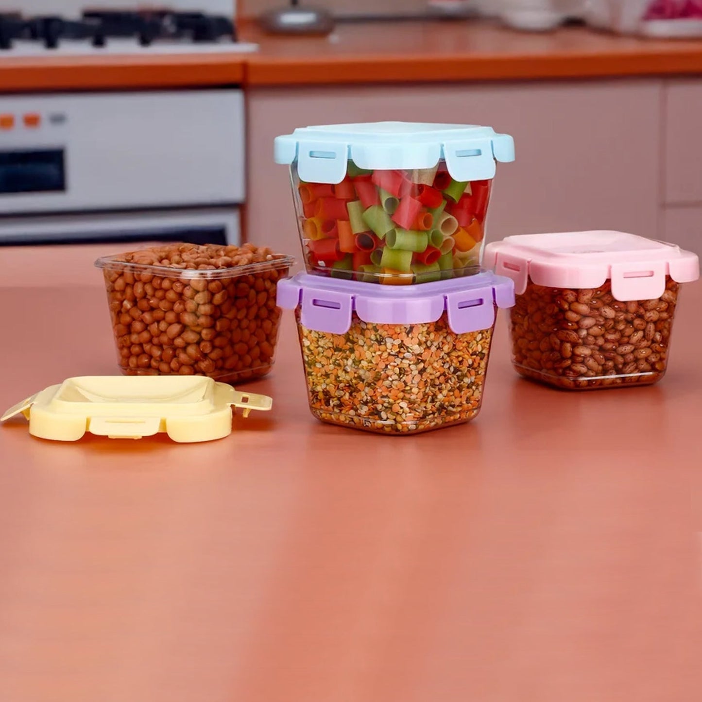 Hand holding a portable 500ml plastic food storage container, convenient for travel.