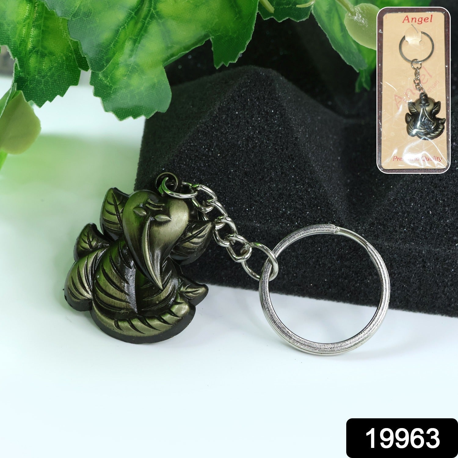 Close-up details of Ganesh Face on antique black metal keychain