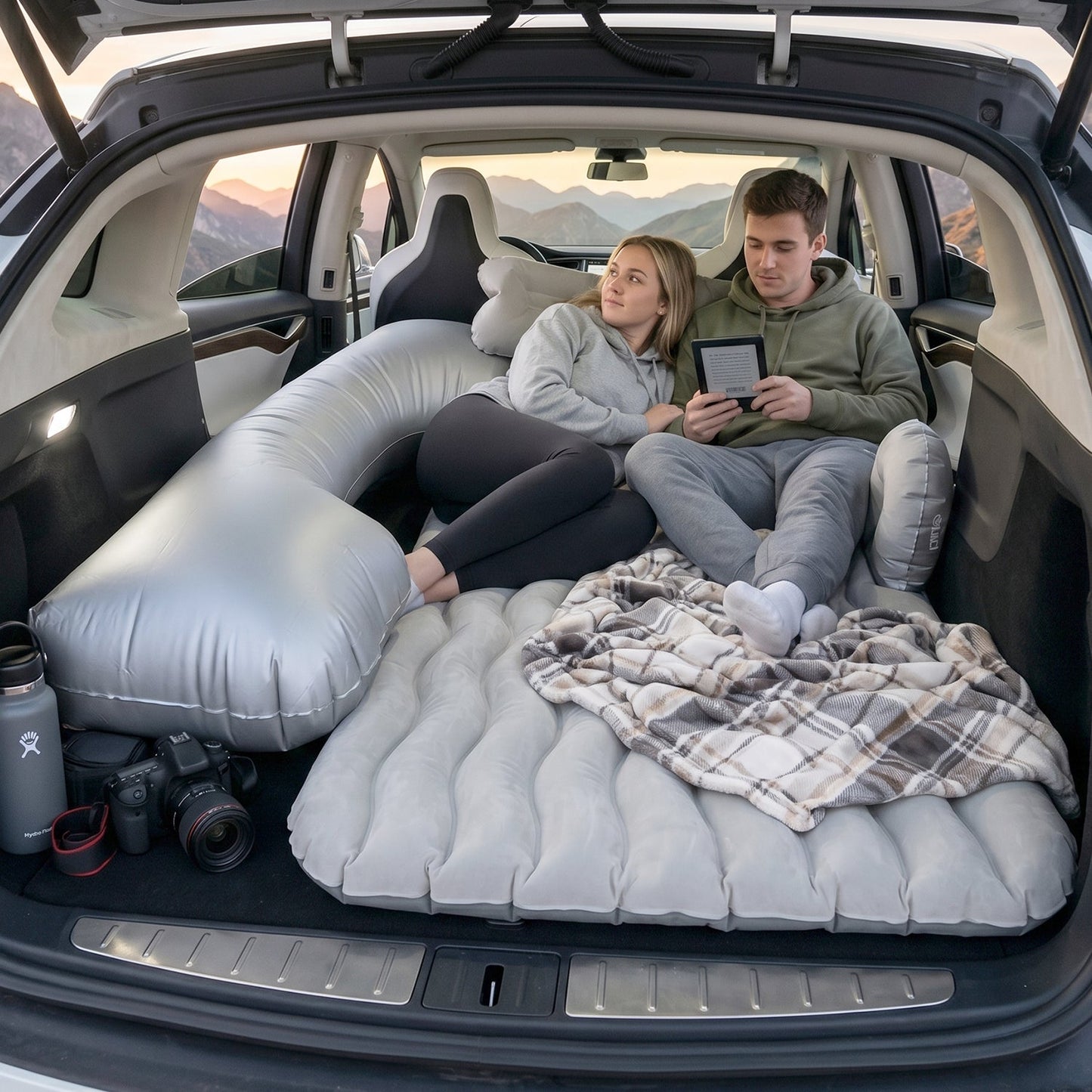 Relaxing couple on car air mattress during road trip