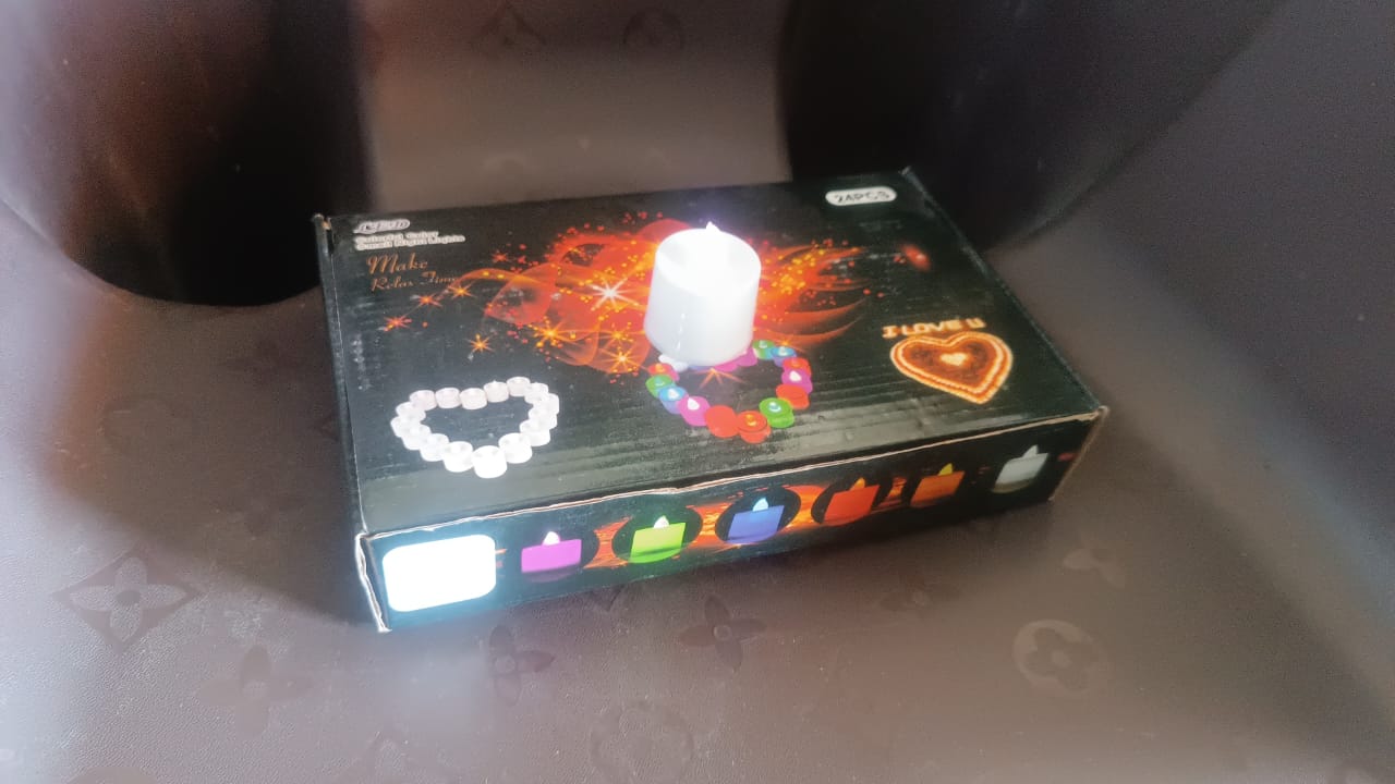 Flameless LED tea light candles in a vibrant festive setting.