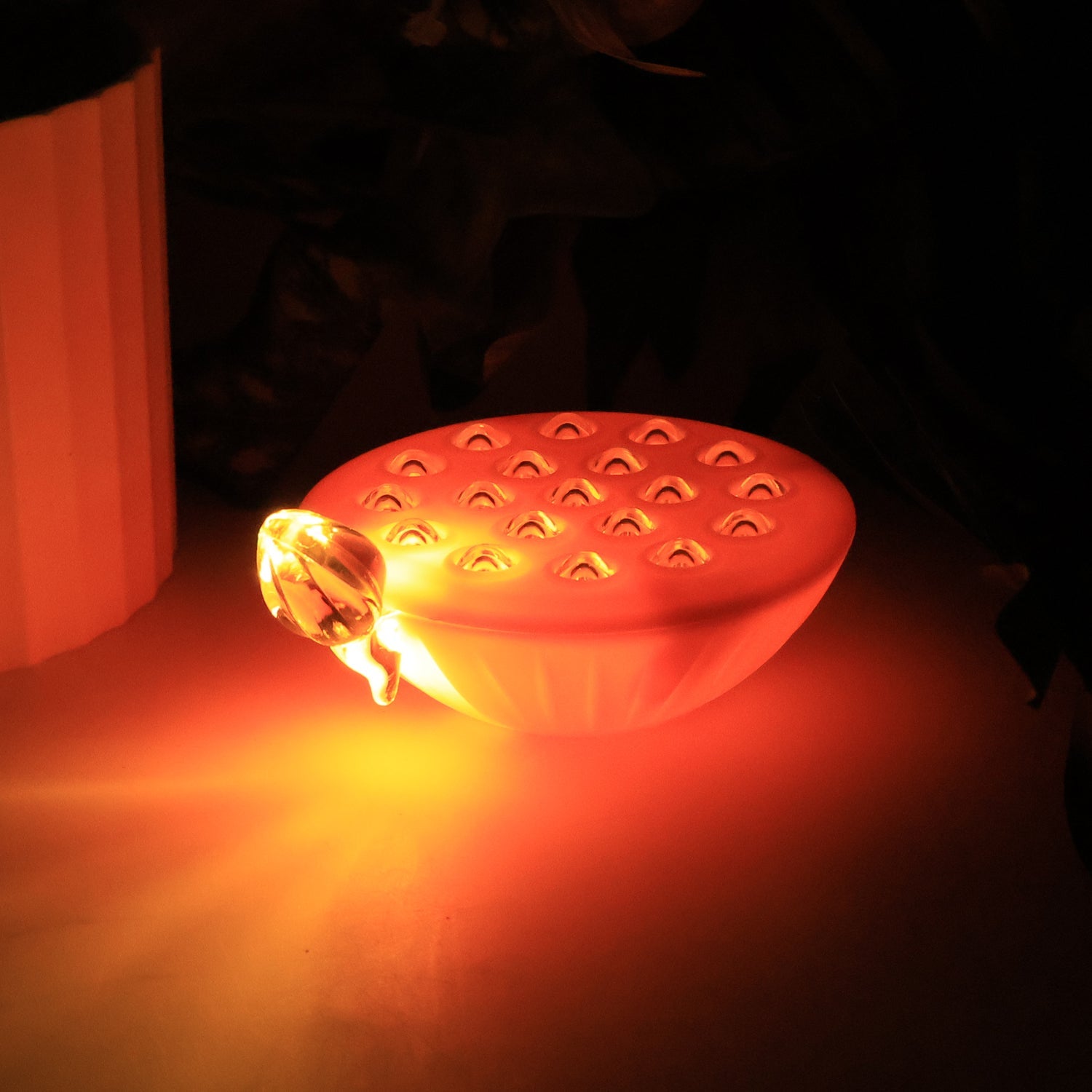 Multicolor lotus LED lamps floating and glowing softly in a decorative bowl