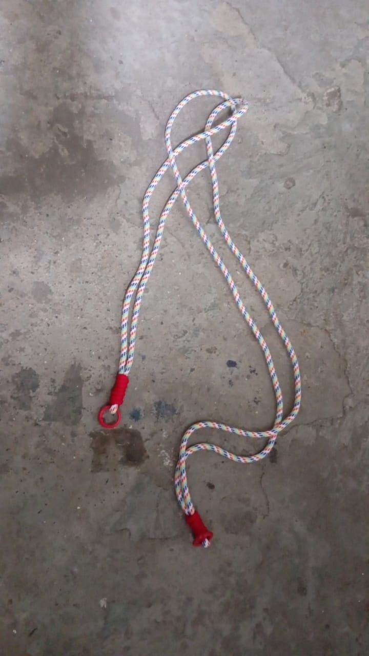 Lifestyle image showing a smartphone easily accessible via its phone lanyard from a bag.