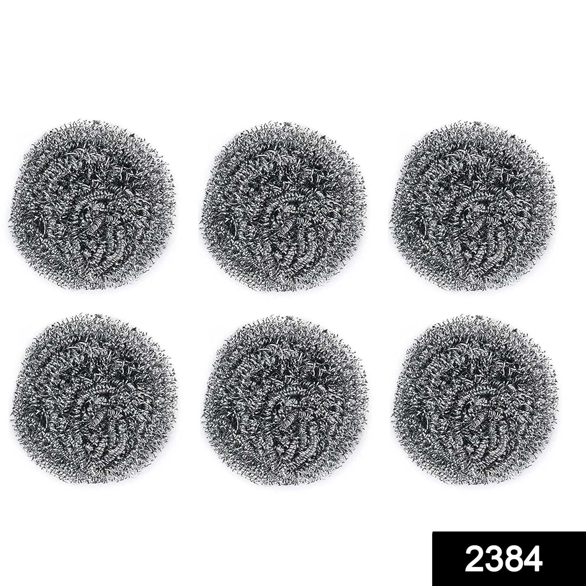 Heavy-duty stainless steel scrubber tackling tough grease on utensils.