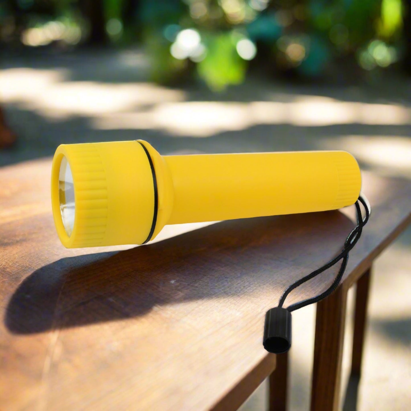 Compact LED flashlight standing upright, ready for emergencies.