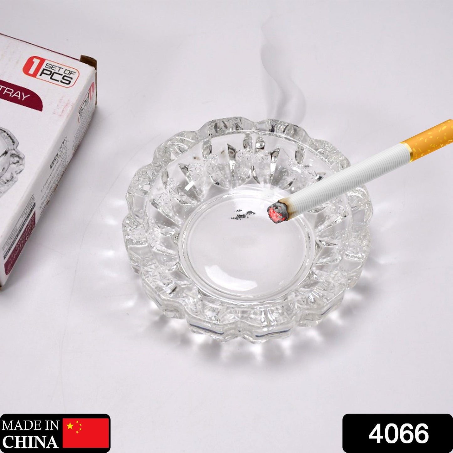 Clear round crystal glass ashtray featuring 4 convenient slots for cigars and cigarettes.
