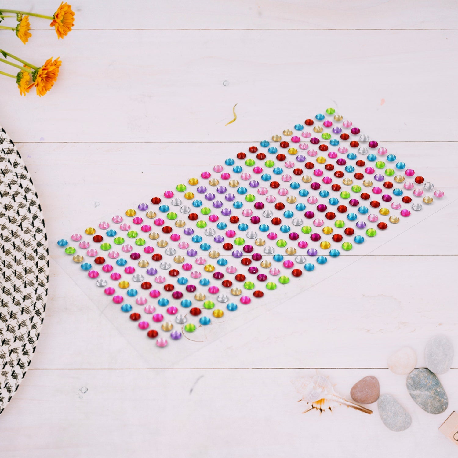Assorted sparkling crystal stickers applied to a phone case and other craft items.
