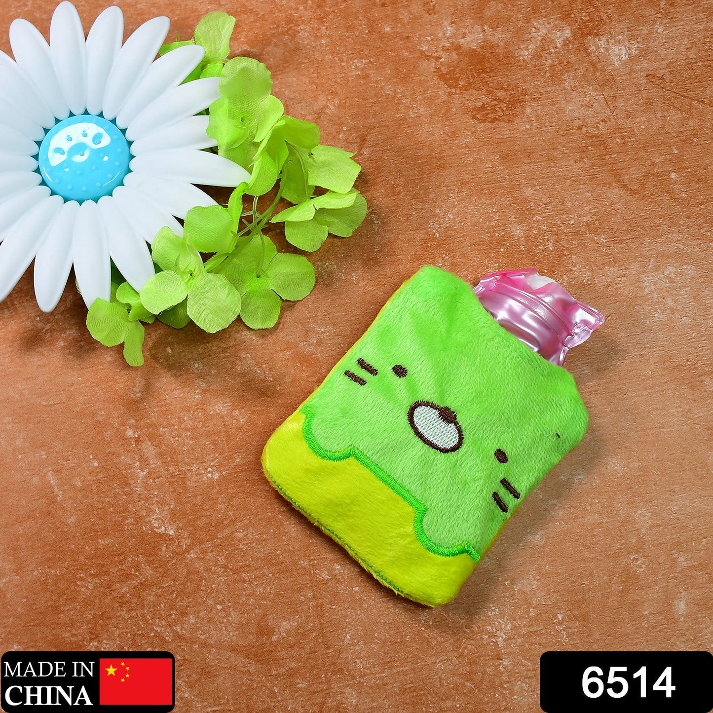 Close-up of the Green Kitty Hot Water Bag showing its plush fabric cover texture.