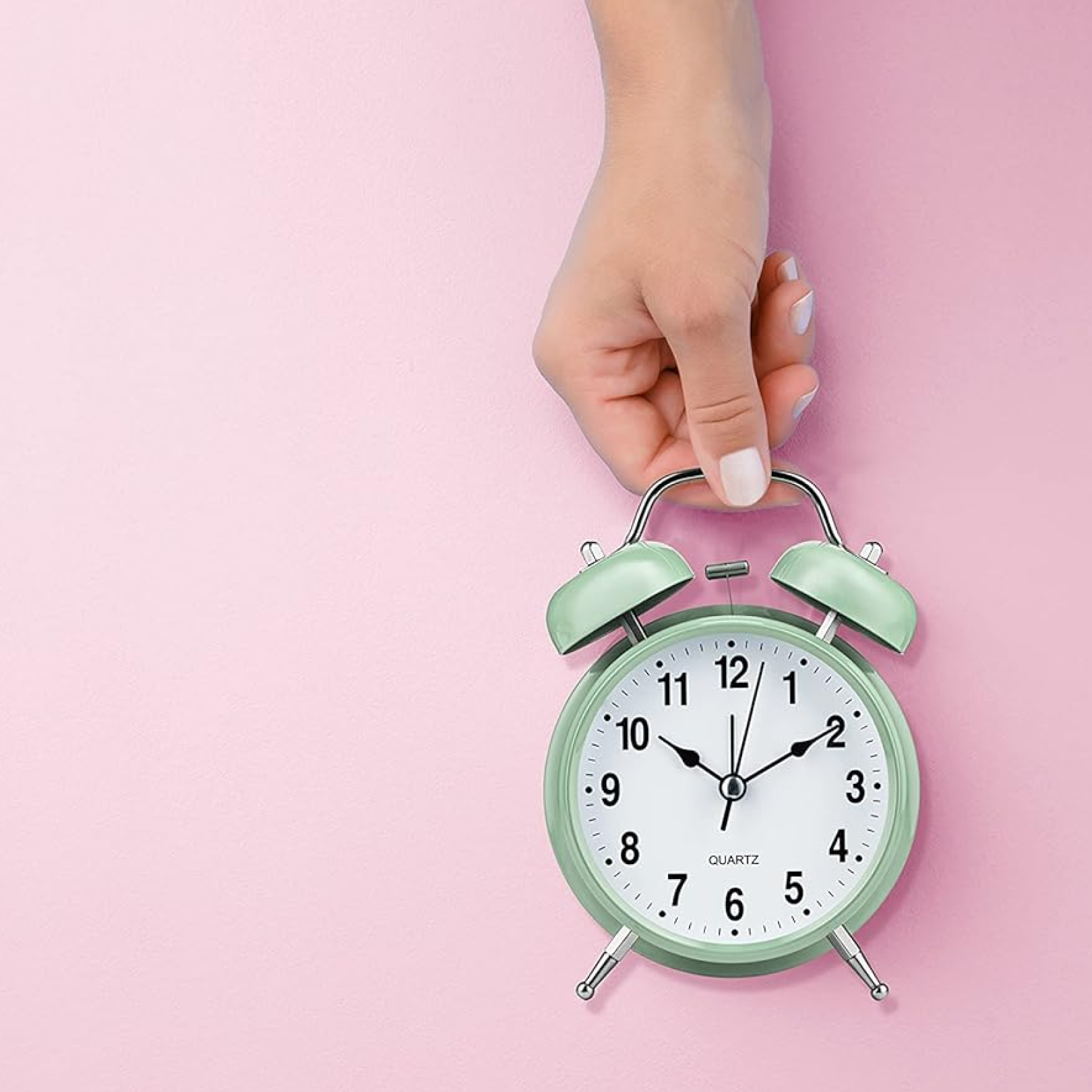Twin-bell analog alarm clock presented in elegant gift packaging.