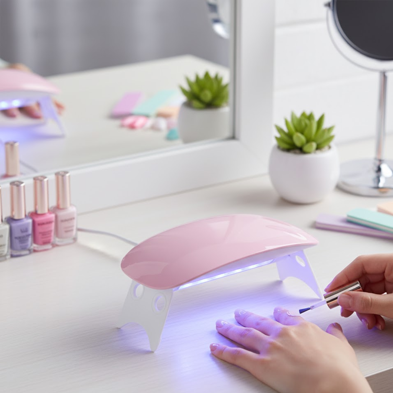 Compact and stylish mini portable Gel Nail Dryer for home use.
