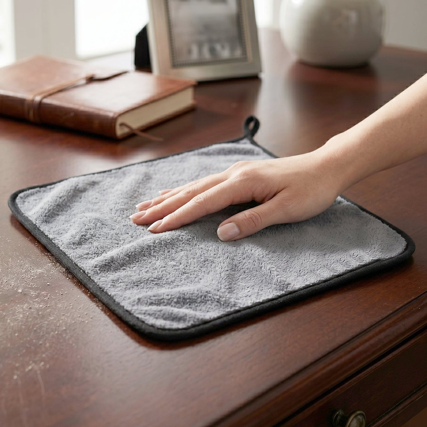 Purple microfiber cleaning cloth wiping surface