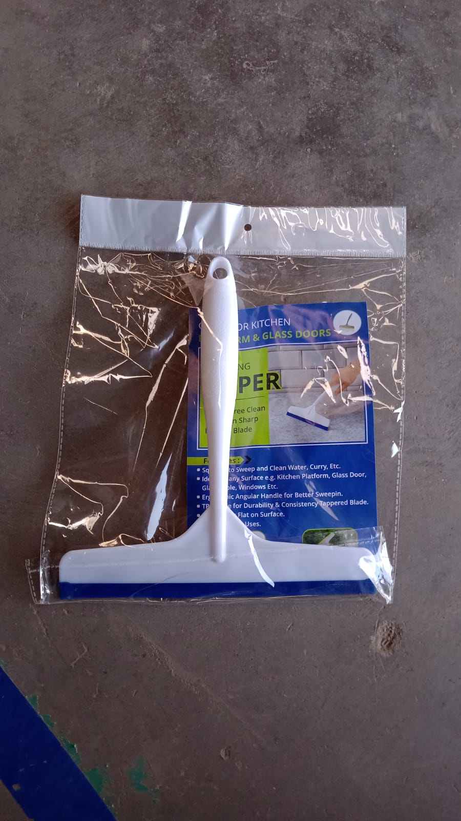 The white kitchen wiper shown from another angle, highlighting its design.