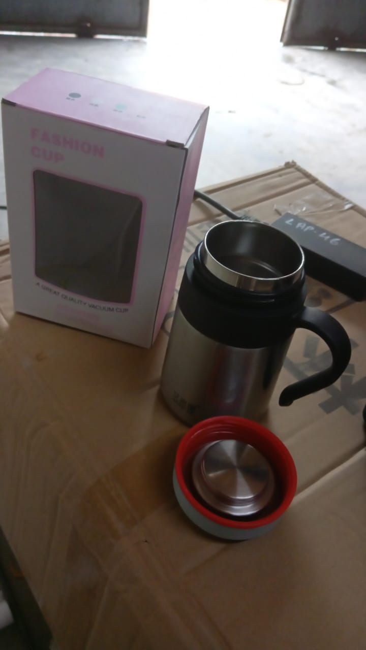 Lifestyle shot of the sleek vacuum insulated mug on a desk.