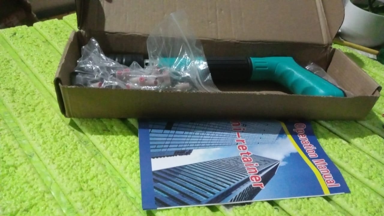 BoltForce manual steel nail gun kit showing the tool, extra nails, and accessories.