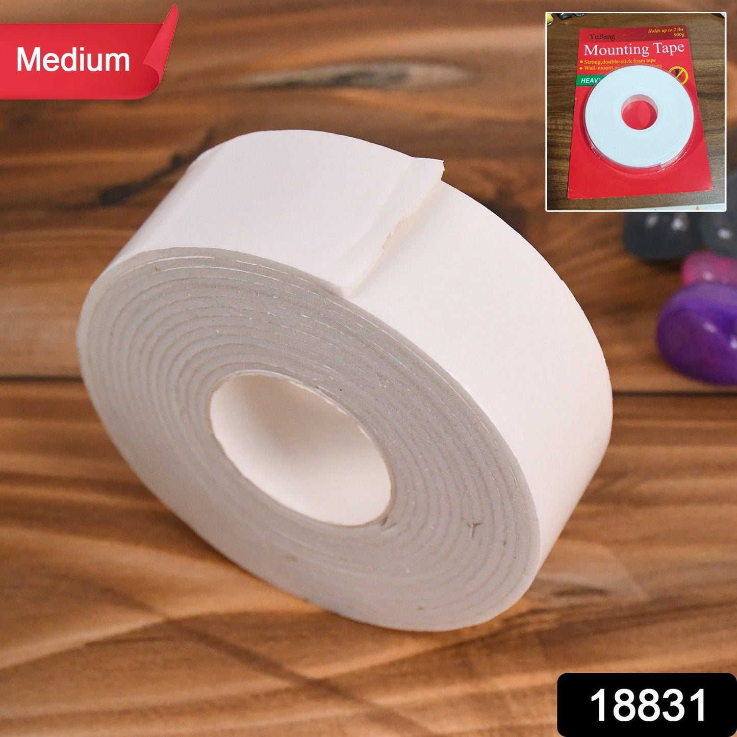 Double sided foam tape holding a picture frame securely on a wall