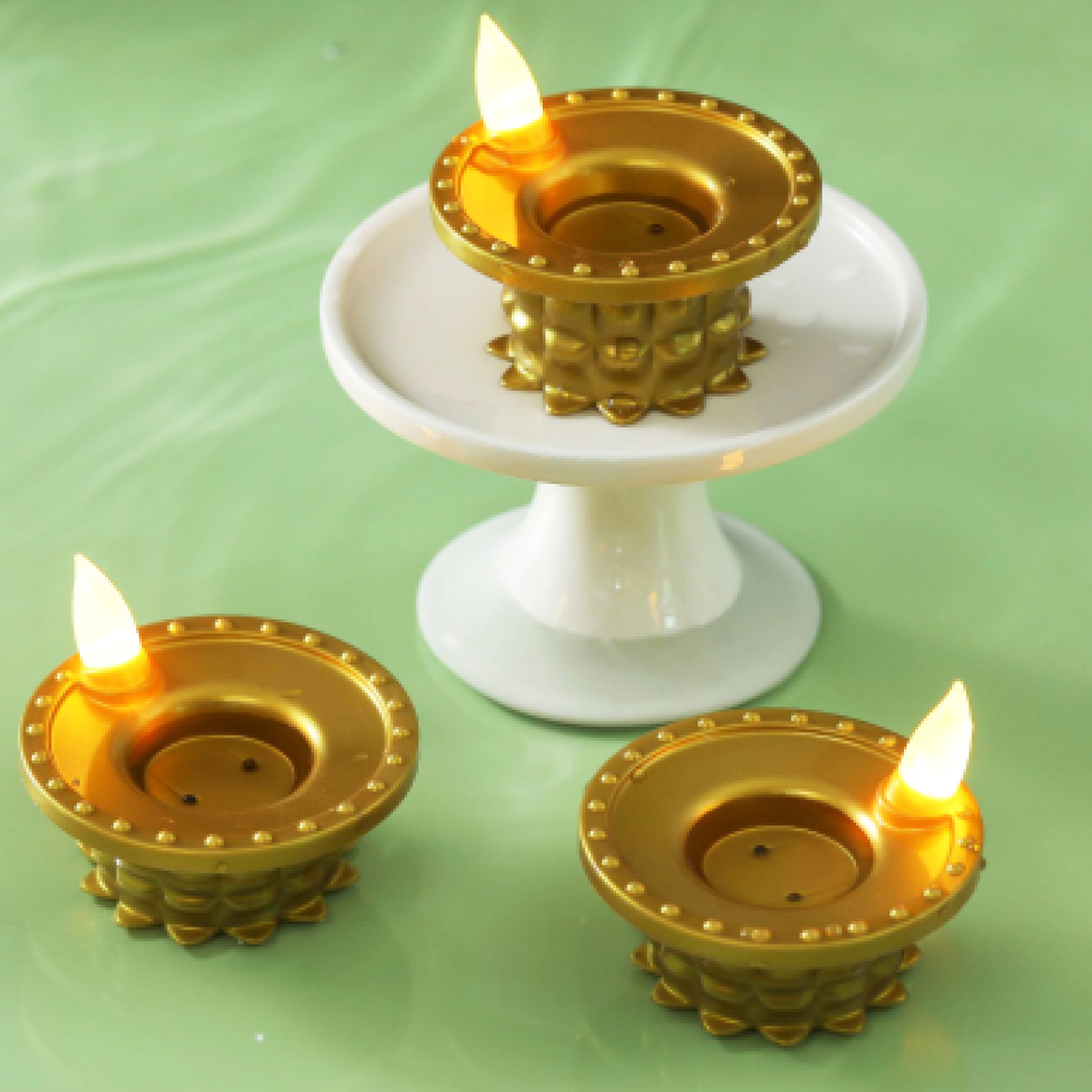 Water sensor LED diyas in a festive setting, ready to be activated by water.