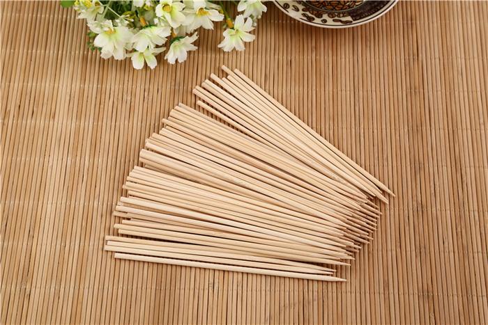 Neatly bundled 30cm bamboo BBQ sticks, perfect for any grilling occasion.