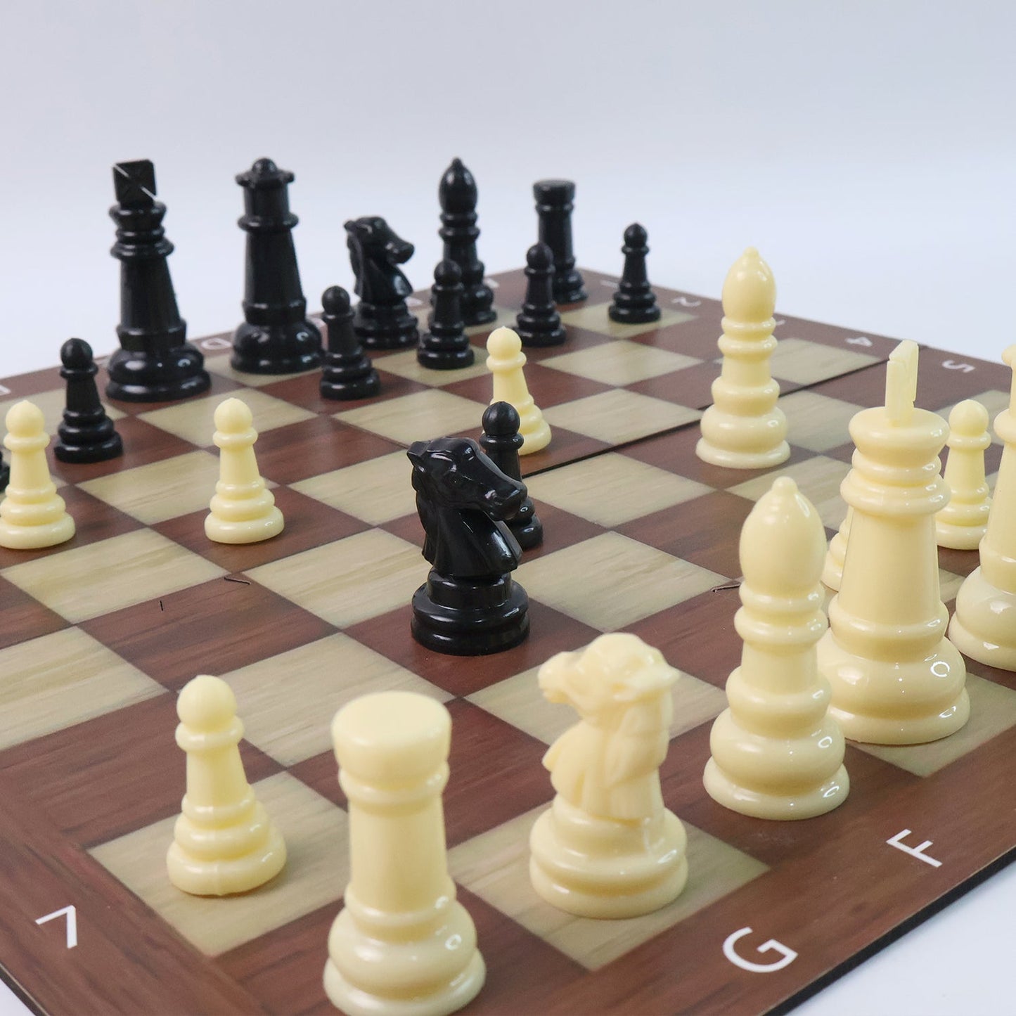 Family enjoying playing Chess & Checkers travel board game
