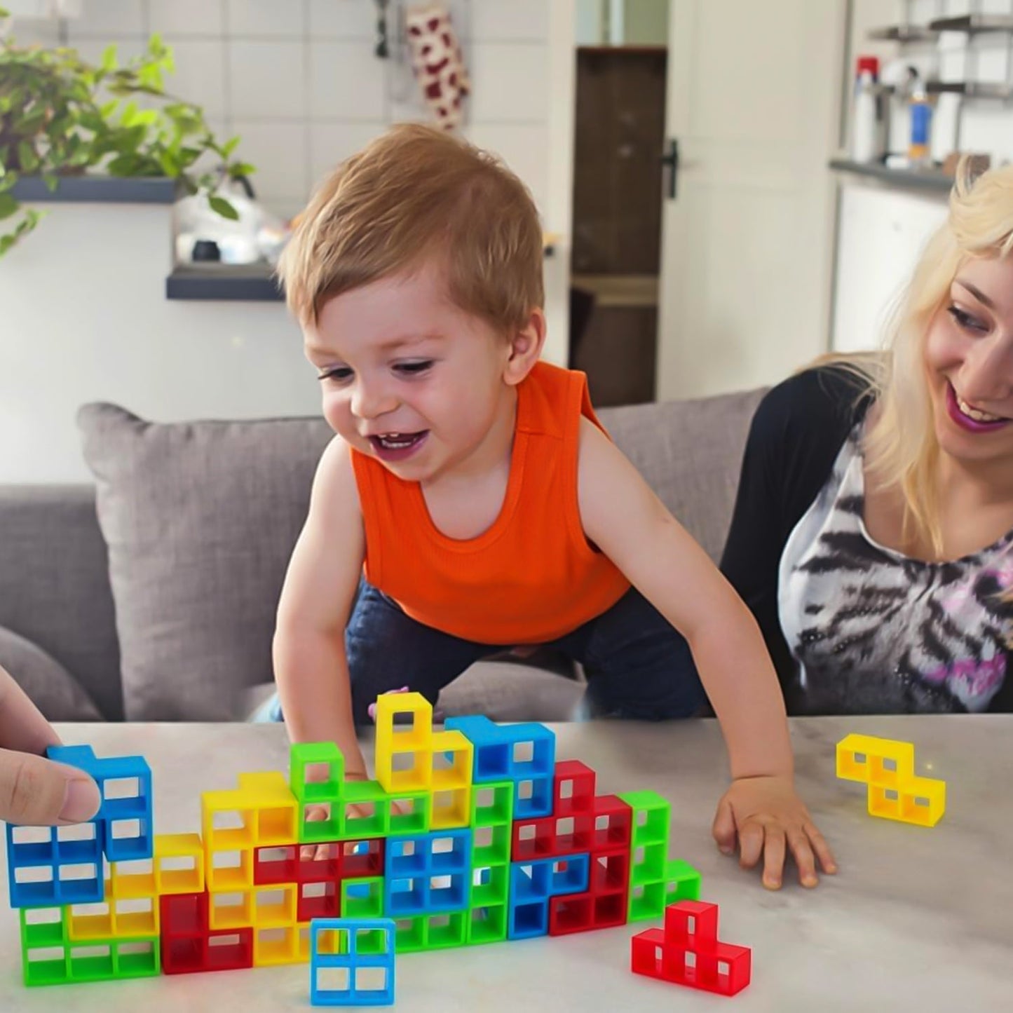 Family playing balance block game toy enhancing skills