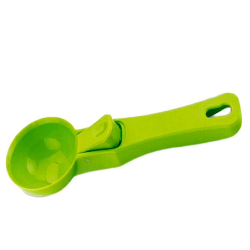 Close-up of the robust green plastic ice cream scoop.