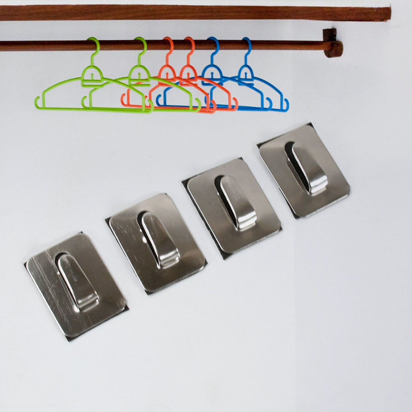 Set of rectangular and rounded heavy-duty self-adhesive wall hooks.