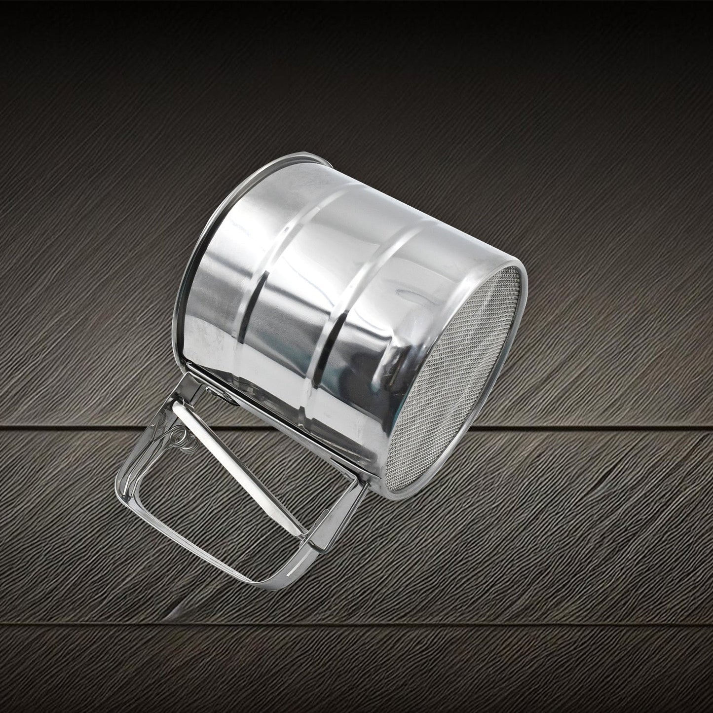 Side view of the durable flour sifter, highlighting its sturdy construction.