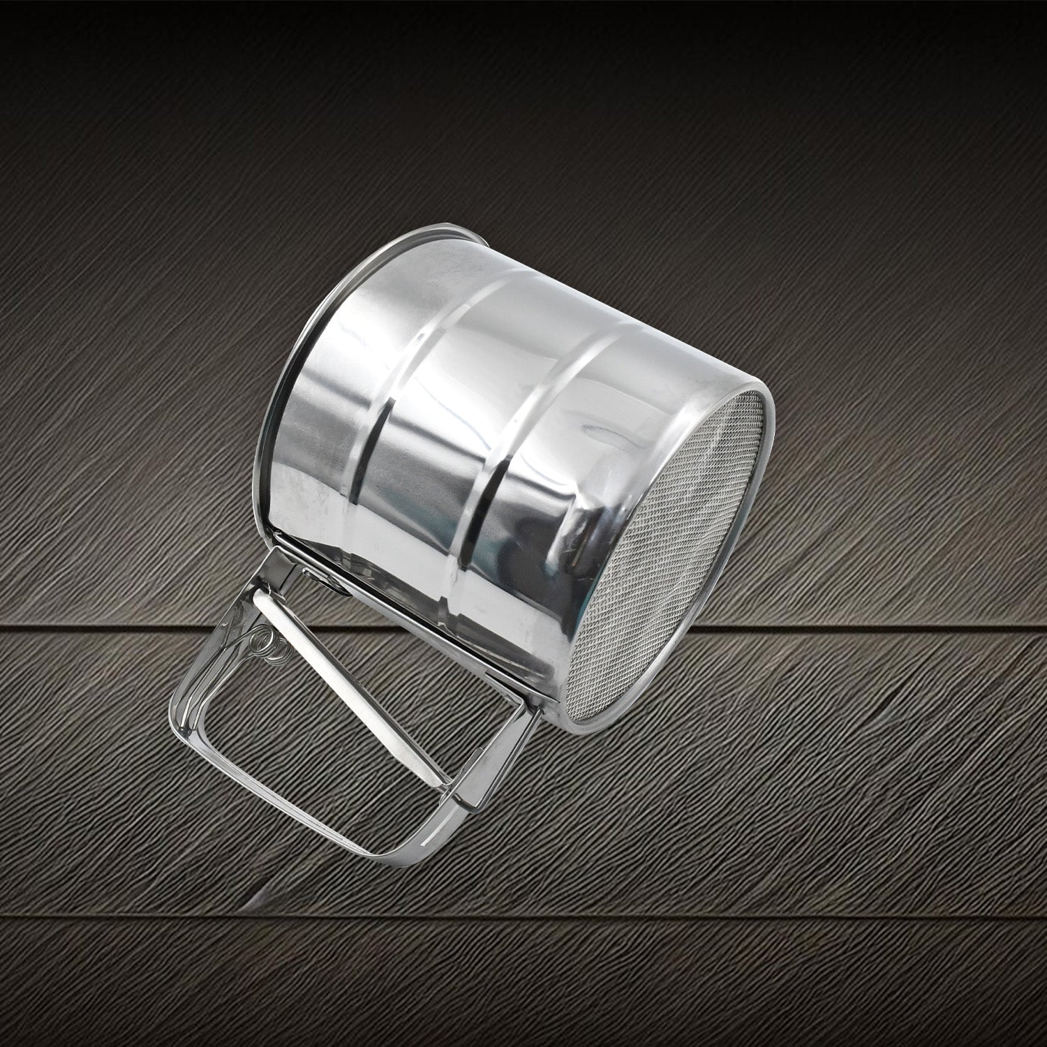 Side view of the durable flour sifter, highlighting its sturdy construction.