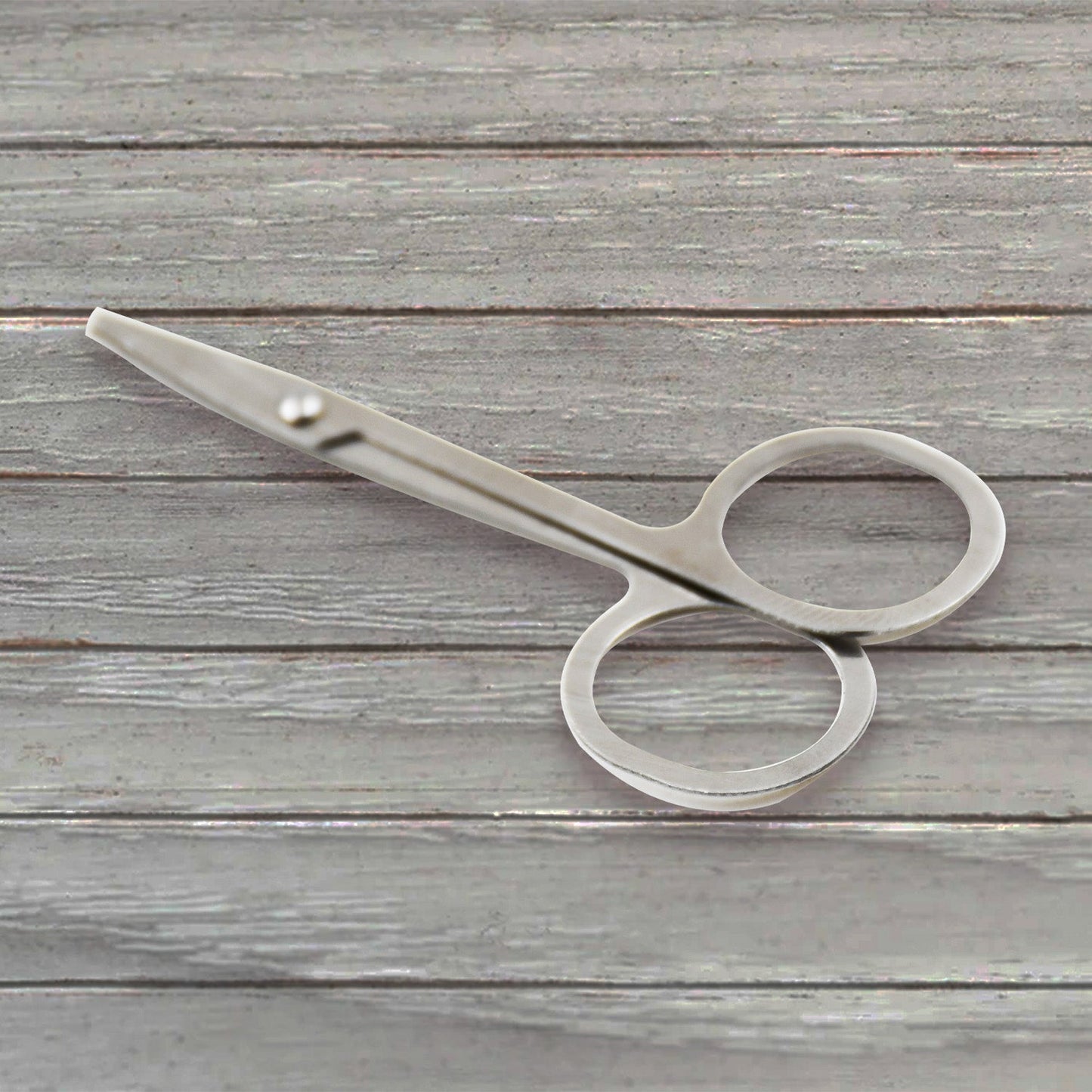 Elegant compact nail clipper set with its clear storage case for easy access.